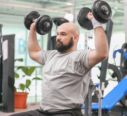 Man pressing weights over head