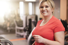 woman smiling on treadmill